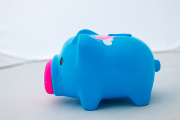 Piggy bank on white background, abstract time to start to saving