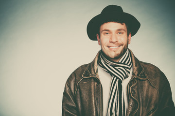 Happy man with half shaved face beard hair in hat.