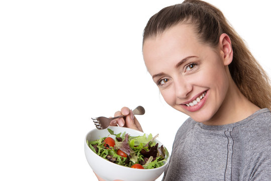 fitness woman eating salad