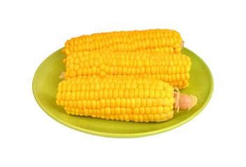Cob of corn on green plate
