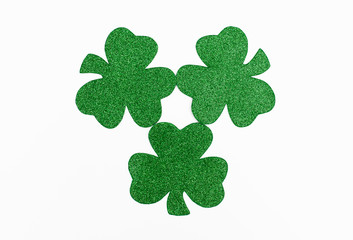 Three party favor glitter shamrocks for St. Patrick's Day.