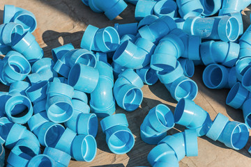 Plumbing fittings on the ground.