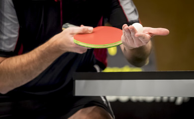table tennis player serving - focus at the ball / small depth of focus