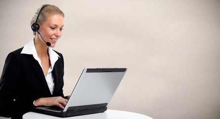 Young business woman working with laptop.