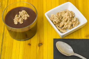 Fresh chocolate mousse with walnut and mint.