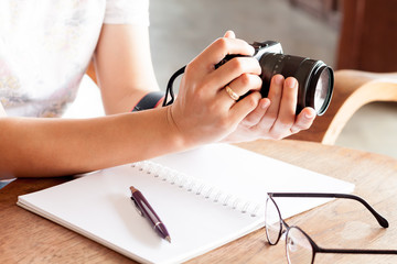 Fototapeta premium Woman with camera in the hands