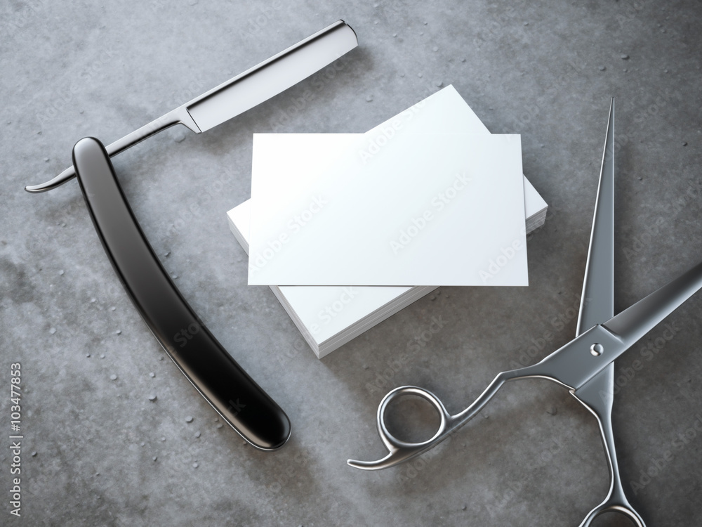 Poster razor and scissors with stack of blank business cards