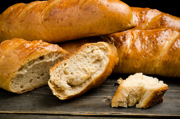 Fresh bread on wooden background
