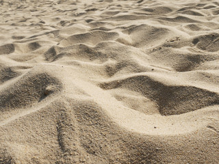 closeup of sand pattern of a beach in the summer
