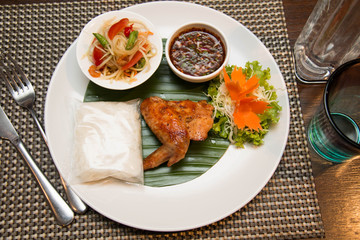  Green papaya salad, grilled chicken and sticky rice