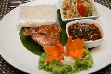  Green papaya salad, grilled chicken and sticky rice