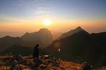 Unidentified Touristm on High mountain in sunset time