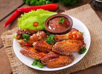 Sour-sweet baked chicken wings and sauce
