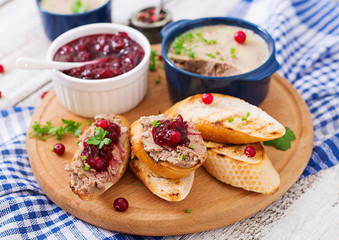 Chicken liver pate with cranberry sauce, served with croutons