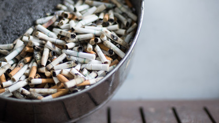Cigarette butt in ashtray.