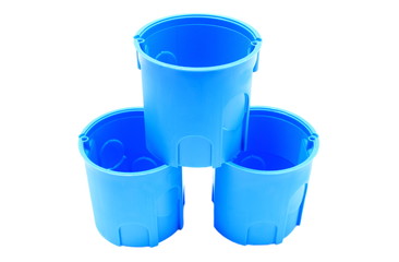 Stack of blue electrical boxes on white background