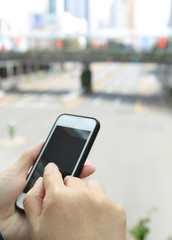 people hands use cellphone in city