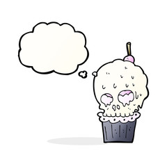 cartoon spooky skull cupcake with thought bubble