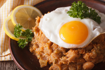 Arabic cuisine: ful medames with a fried egg macro. horizontal
