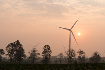 Fototapeta na wymiar silhouette of wind turbines at sunset