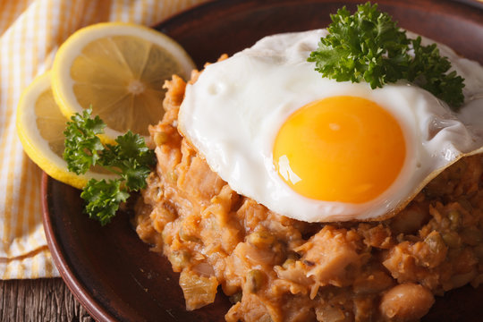 Arabic cuisine: ful medames with a fried egg macro. horizontal
