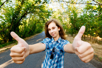 emotional girl shows a finger up, sign ok