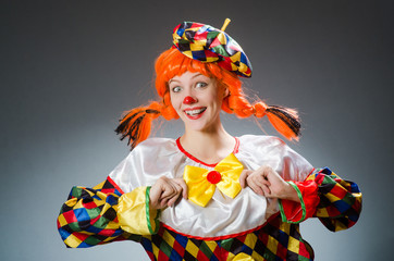 Clown in funny concept on dark background