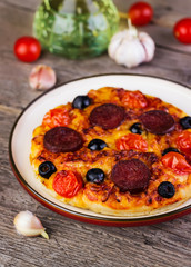 hot homemade pizza  with cheese, tomatoes, olives