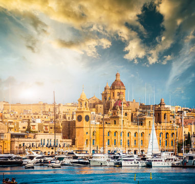 view on Birgu and the harbour with boats