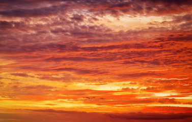 Naklejka na ściany i meble Fiery orange sunset sky. Beautiful apocalyptic sunset sky.