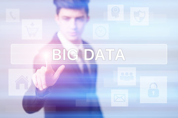 businessman pressing button on virtual screens