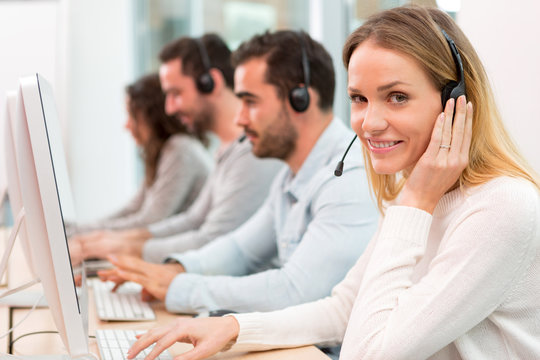 Young attractive woman working in a call center