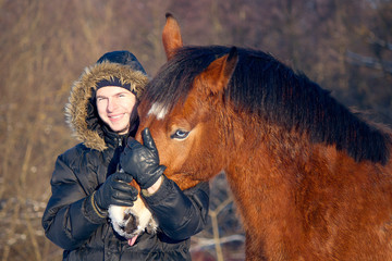Boy and his horse with blue eyes