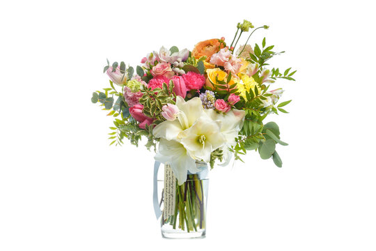 Beautiful bouquet of bright flowers in vase isolated white
