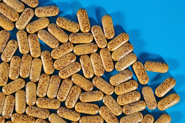 Top view of pills on a blue