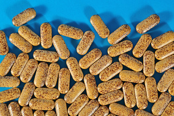 Top view of pills on a blue