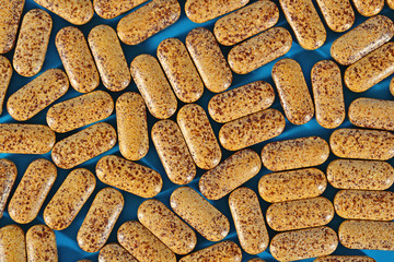 Top view of pills on a blue