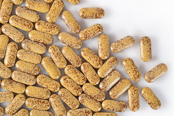 Top view of pills on a white
