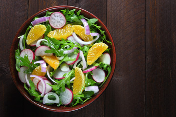 Salad with arugula, radish,red onion and tangerine