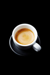 Glass of espresso on a black background
