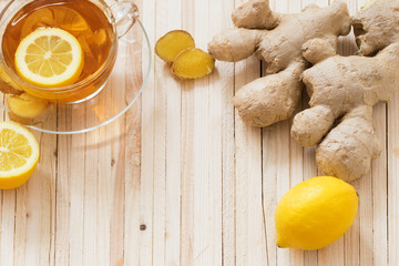 cup of ginger tea on a wooden table