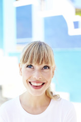 Fototapeta premium Excited young blond woman looking up