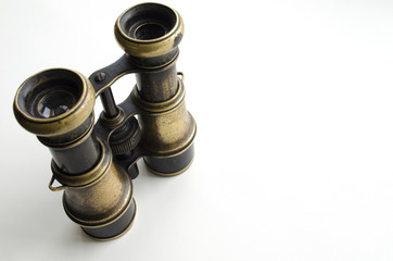 Vintage binoculars on a light background
