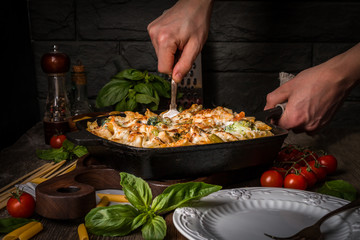 Baked pasta with broccoli, cauliflower, cheese and bechamel sauc