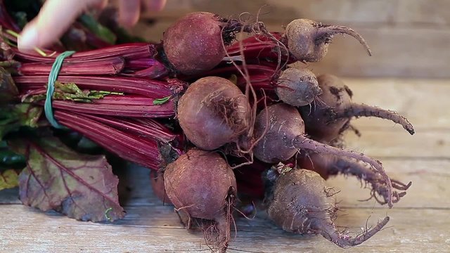 Fresh beetroots on wood background.
