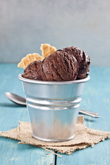 Chocolate ice cream cup on the blue table.
