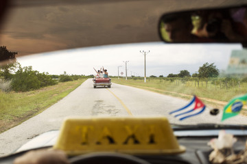 Happy woman on a convertible car in Cuba, enjoy Cuba country