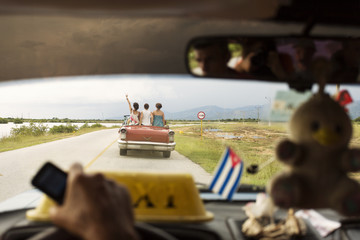 Happy woman on a convertible car in Cuba, enjoy Cuba country
