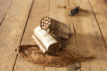 Fototapeta na wymiar Cuban cigars in traditional artisan palm leafs box, Cuba.