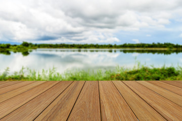 Wood table top on blurred Lake and sky background for presentation product. - 103506023